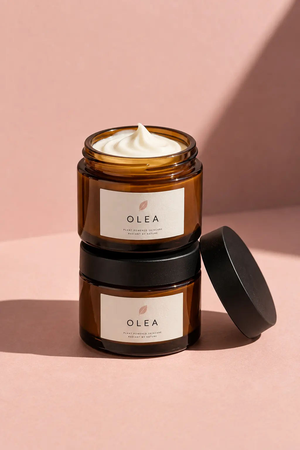 Two stacked OLEA jars, the top one open